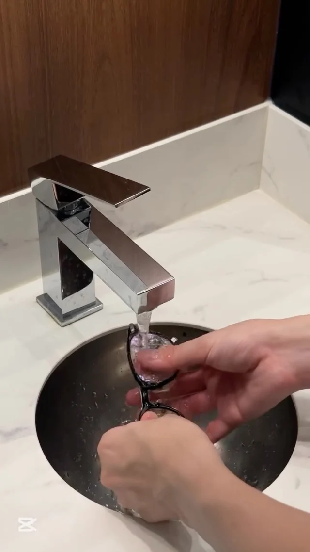 Image 60: Are you cleaning your glasses correctly? If u don’t have a ultrasonic machine like we do (haha), here are some steps you can follow to keep your glasses clean at home: 1️⃣ Rinse your glasses under lukewarm water to remove dust and debris 2️⃣ Apply a drop of mild dish soap to your fingertips and gently rub both sides of the lenses and the frame 3️⃣ Rinse thoroughly to wash away all soap 4️⃣ Dry with a clean microfiber cloth—never use tissues or your shirt! 💡Bonus tip: Avoid hot water (it can damage coatings) and harsh cleaners! All Eye Theory customers enjoy complimentary cleaning anytime—just drop by! #glassescleaningtip #ultrasoniccleaning #eyewearcare #glasses #cleanglasses #eyetheory